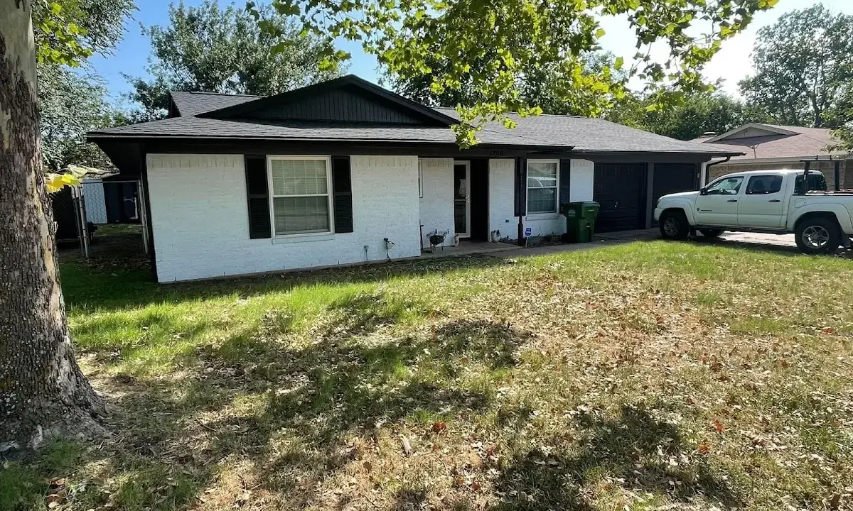 Professional roofing crew working on a residential roof in West Rockhill